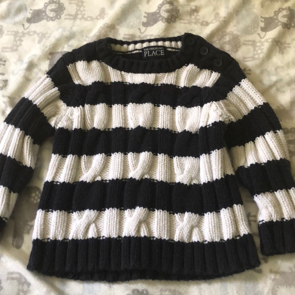 Blue and white cable knit sweater